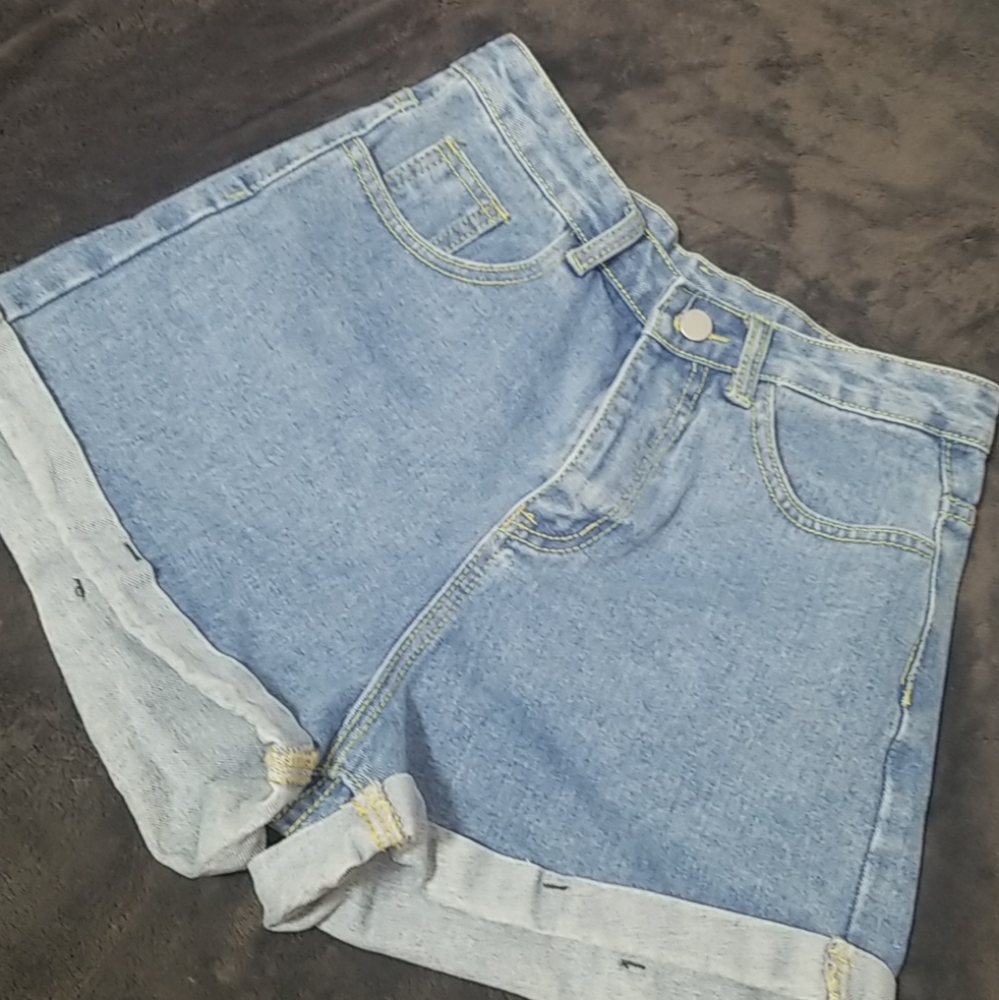 High waisted shorts with green stitching